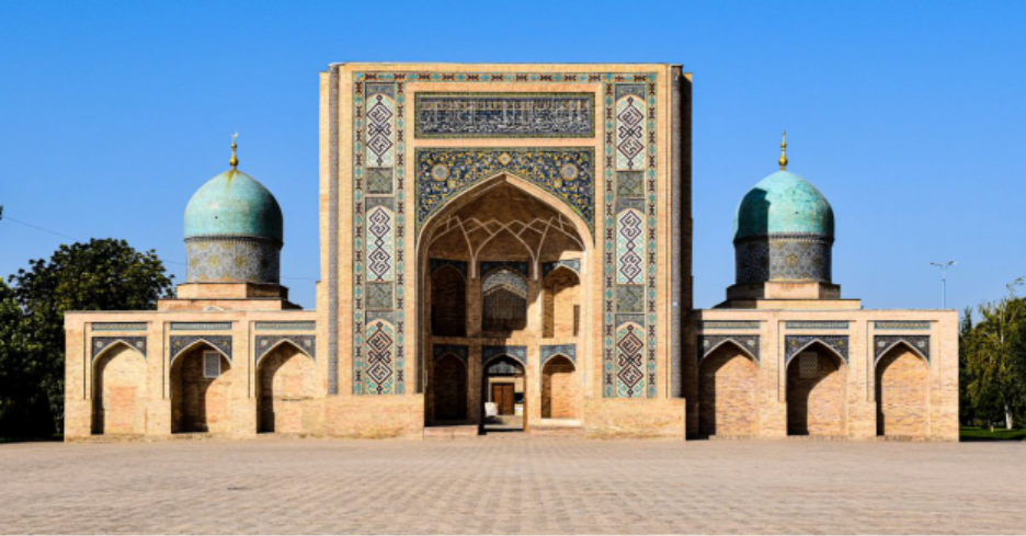 Front view of the historic Barakhan Madrasah with a blue dome in Tashkent, Uzbekistan